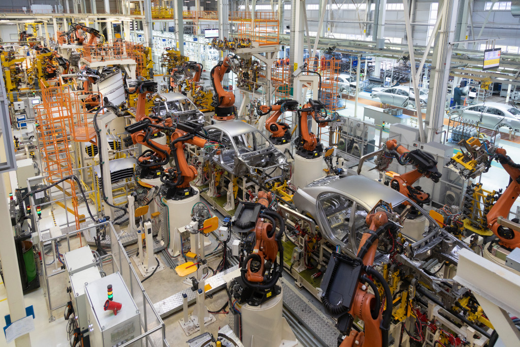 car manufacturing plant showcasing mechanical equipment in assembling cars
