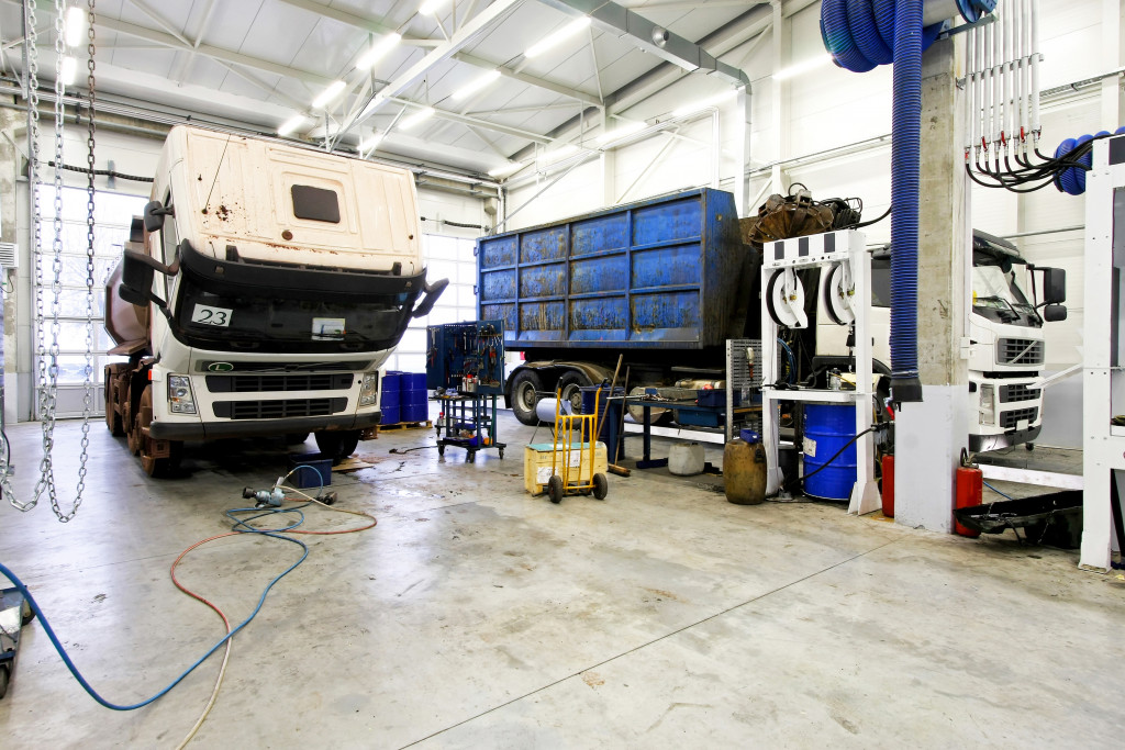 A big truck being serviced in a garage 